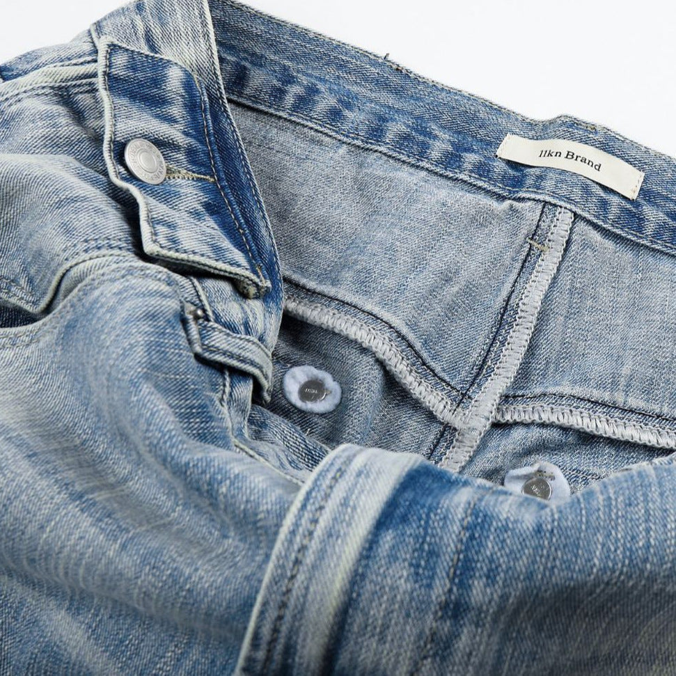 Light Blue Wide-Leg Denim Jeans with Heart Stitching