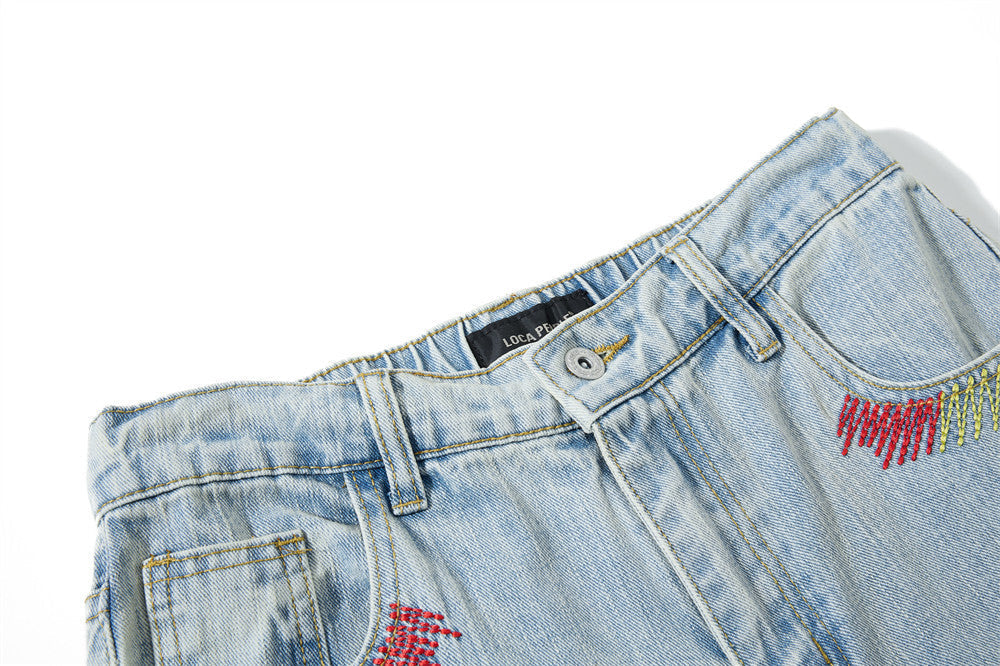 Light Blue Wide-Leg Jeans with Multi-Colored Embroidery