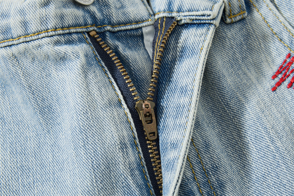 Light Blue Wide-Leg Jeans with Multi-Colored Embroidery