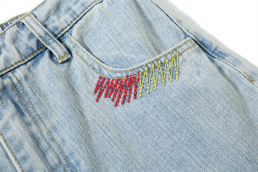 Light Blue Wide-Leg Jeans with Multi-Colored Embroidery