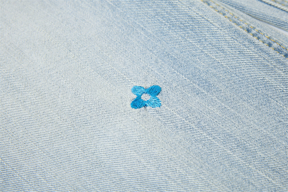 Light Blue Wide-Leg Jeans with Multi-Colored Embroidery