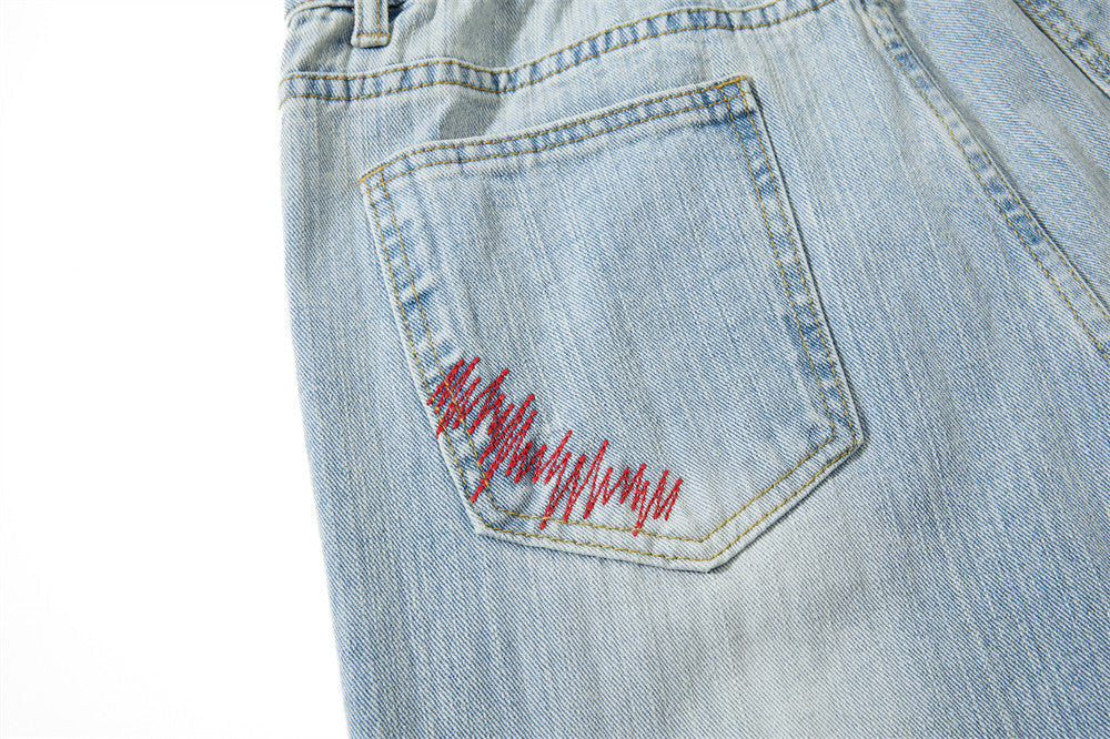 Light Blue Wide-Leg Jeans with Multi-Colored Embroidery