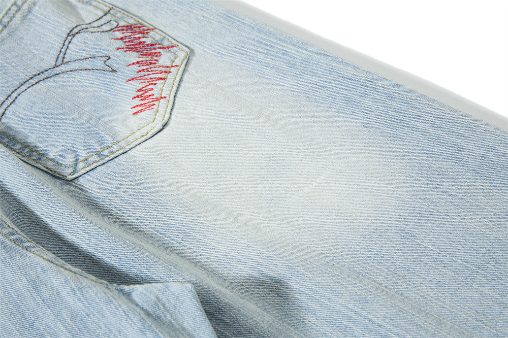 Light Blue Wide-Leg Jeans with Multi-Colored Embroidery