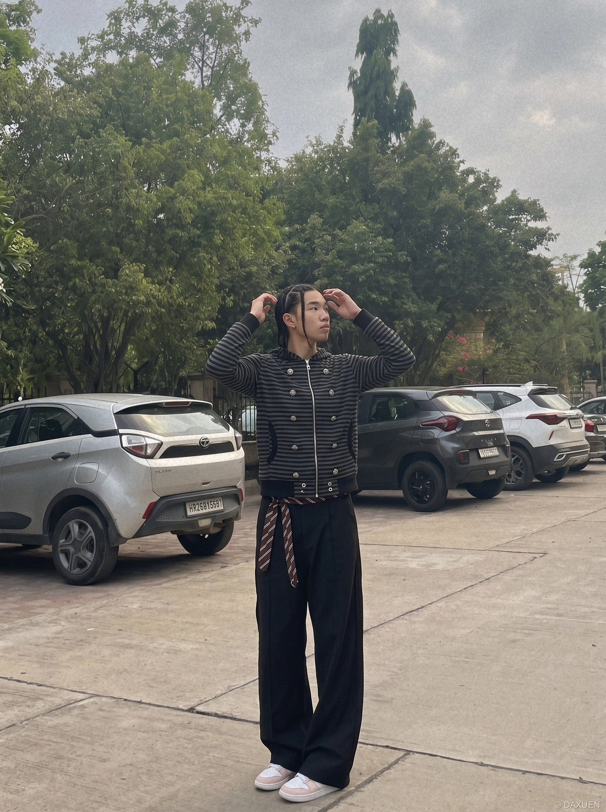 DAXUEN black and grey striped metallic-studded zip-up hoodie — model photo
