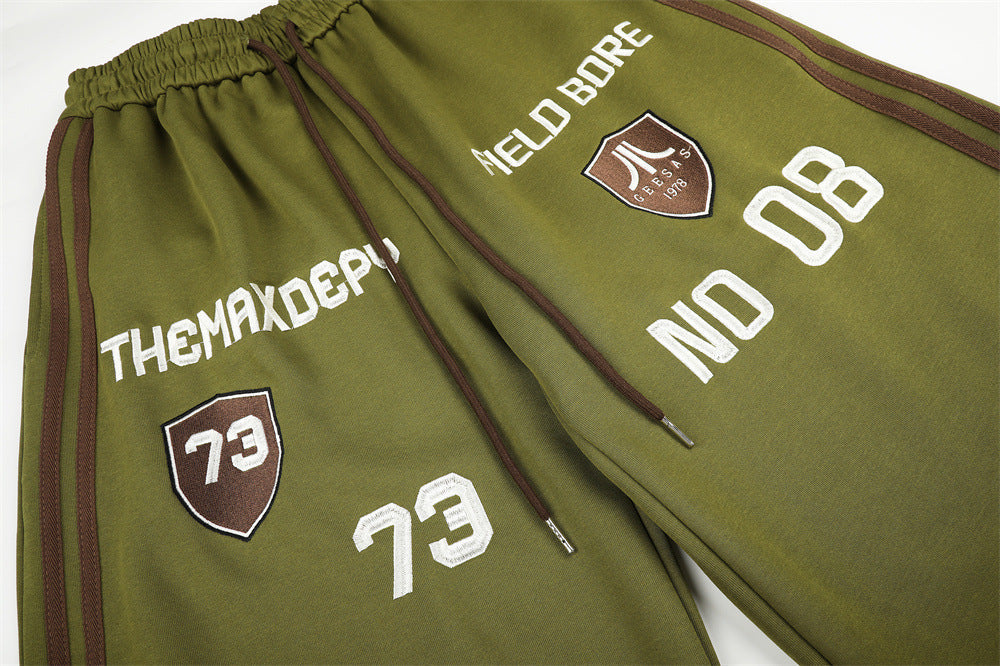 Olive Green Balloon Track Pants with Bold Graphics