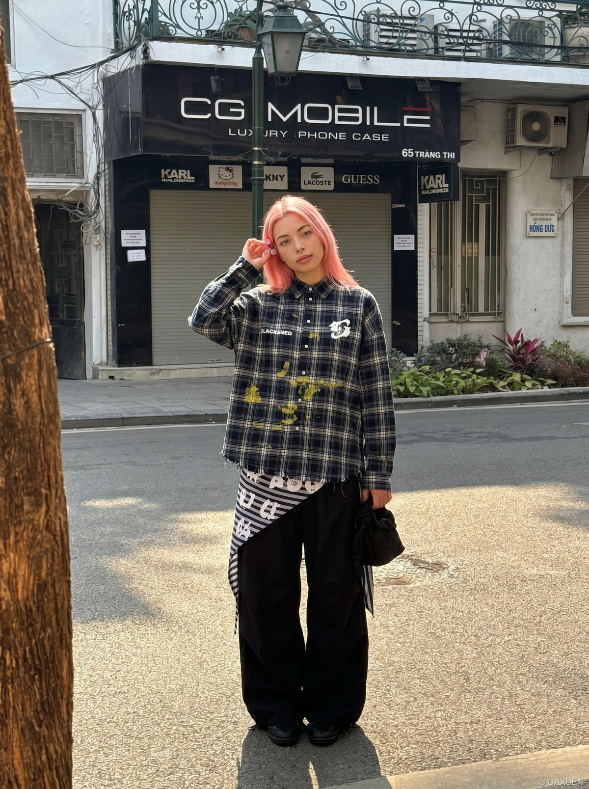 DAXUEN Oversized dark plaid button-up shirt with graphics — model photo