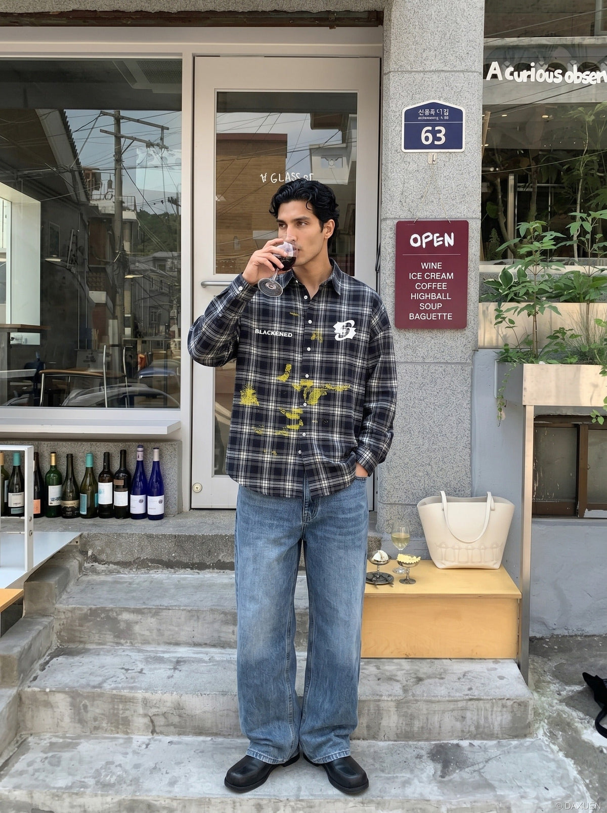 DAXUEN Oversized dark plaid button-up shirt with graphics — model photo
