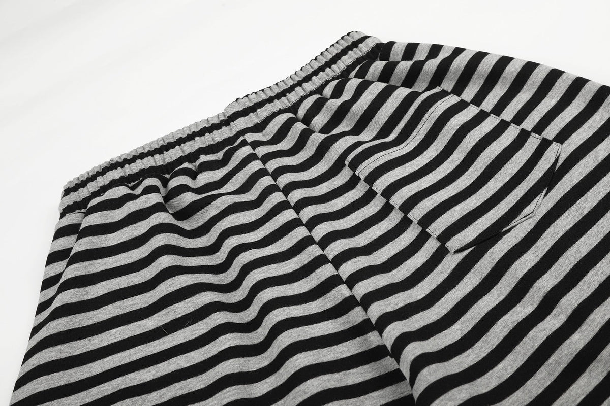 DAXUEN striped wide-leg pants with skull and structure patches