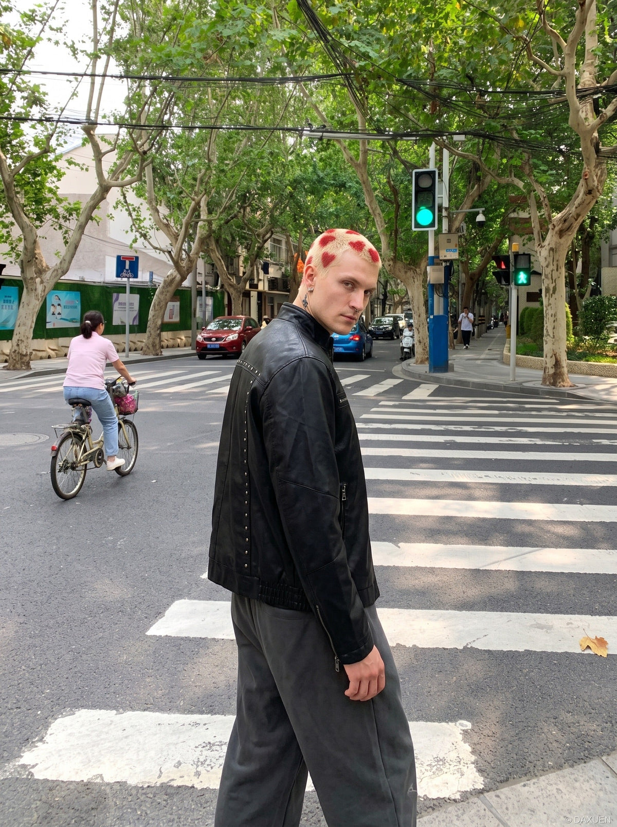DAXUEN black leather-look jacket with zippered details — model photo