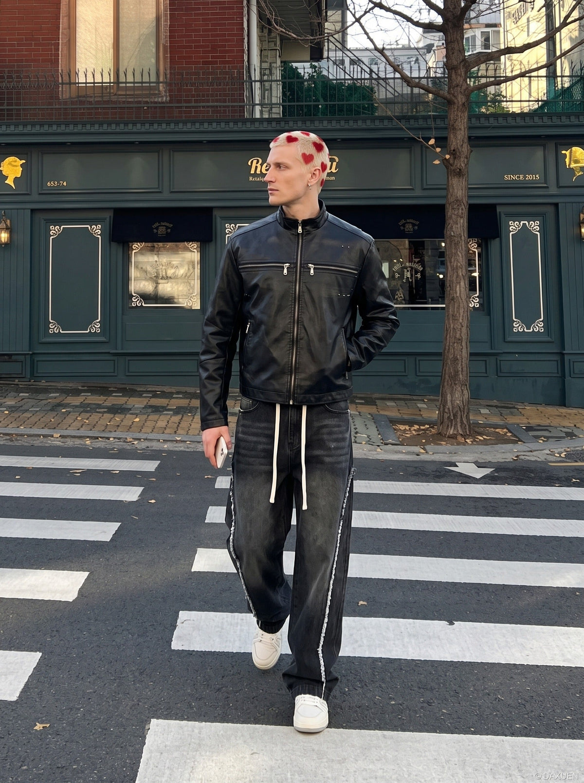 DAXUEN black leather-look jacket with zippered details — model photo
