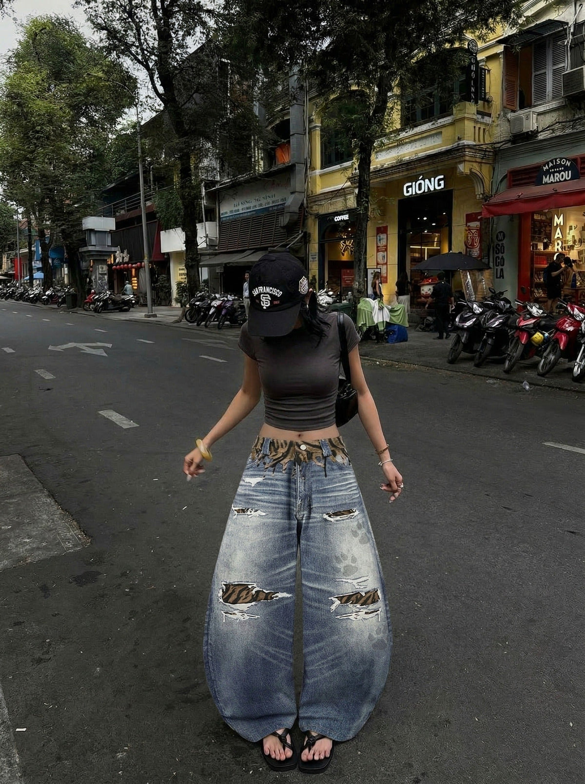 DAXUEN Distressed wide-leg jeans with tiger stripe pattern — model photo