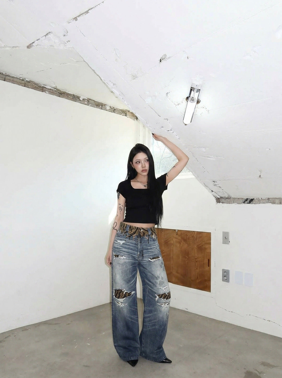 DAXUEN Distressed wide-leg jeans with tiger stripe pattern — model photo