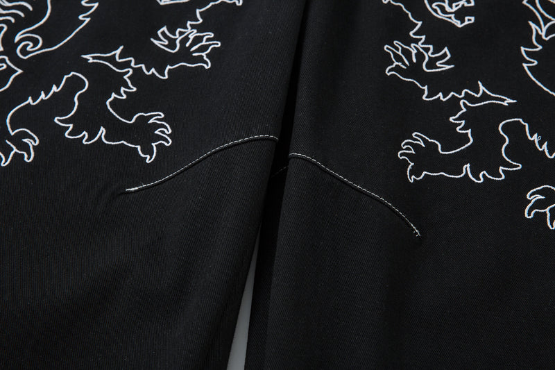 Madxmarx Embroidered Crest Wide-Leg Jeans