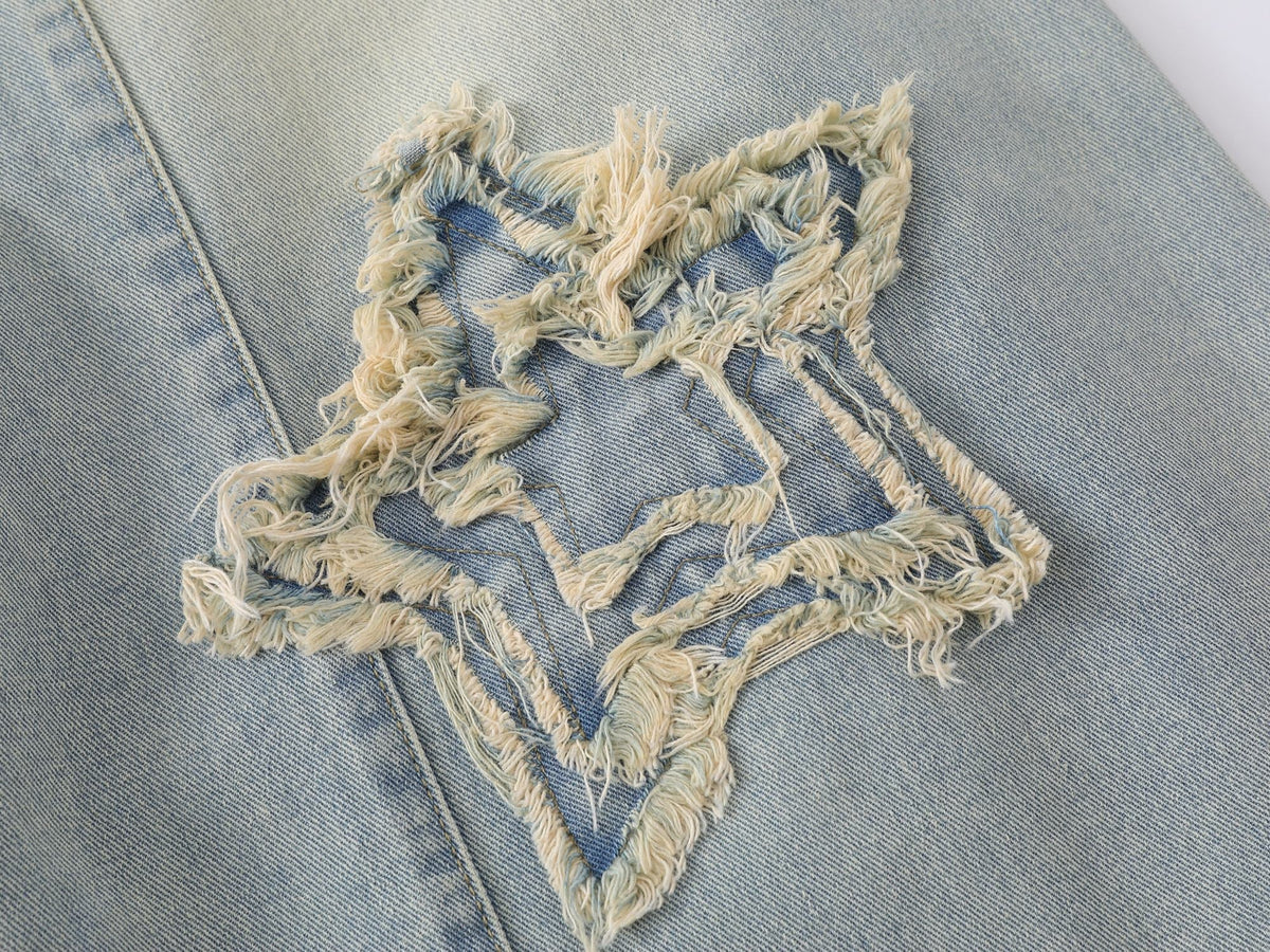 Jeans de pierna ancha con efecto desgastado y estrellas de Madxmarx