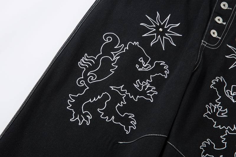 Madxmarx Embroidered Crest Wide-Leg Jeans